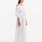 "Side view of the Dante White Dress, showcasing the long puffed sleeves and the flowing, ankle-length silhouette."