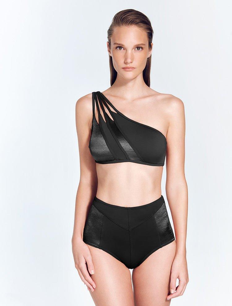 "Front view of the Darika Black Bikini Top, showing the geometric one-shoulder design and cutout details."