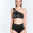 "Front view of the Darika Black Bikini Top, showing the geometric one-shoulder design and cutout details."