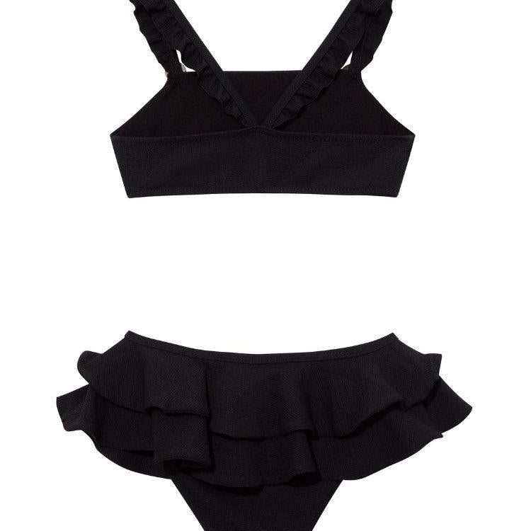 Dassy Black Ruffle Strap Kids Bikini Set with Layered Skirt | Moeva | Bikini Set | Each week unveils new pieces—luxury swimwear, fluid resort silhouettes, and elevated summer-to-evening essentials designed to carry you from coastal escapes to city nights.
