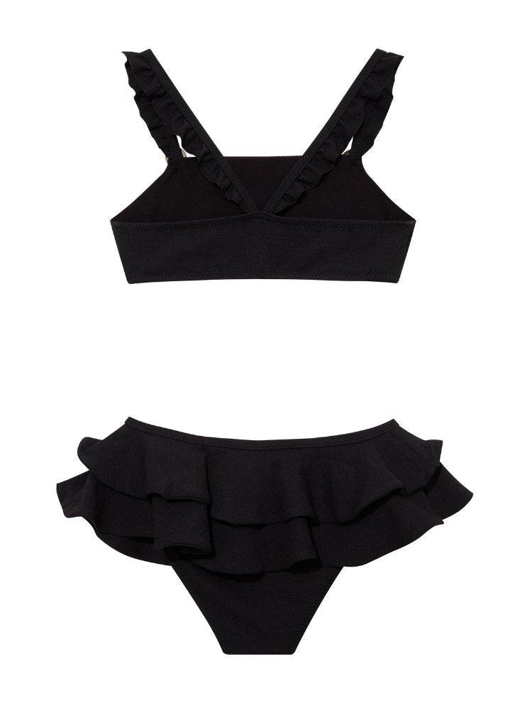 Dassy Black Ruffle Strap Kids Bikini Set with Layered Skirt | Moeva | Bikini Set | Each week unveils new pieces—luxury swimwear, fluid resort silhouettes, and elevated summer-to-evening essentials designed to carry you from coastal escapes to city nights.