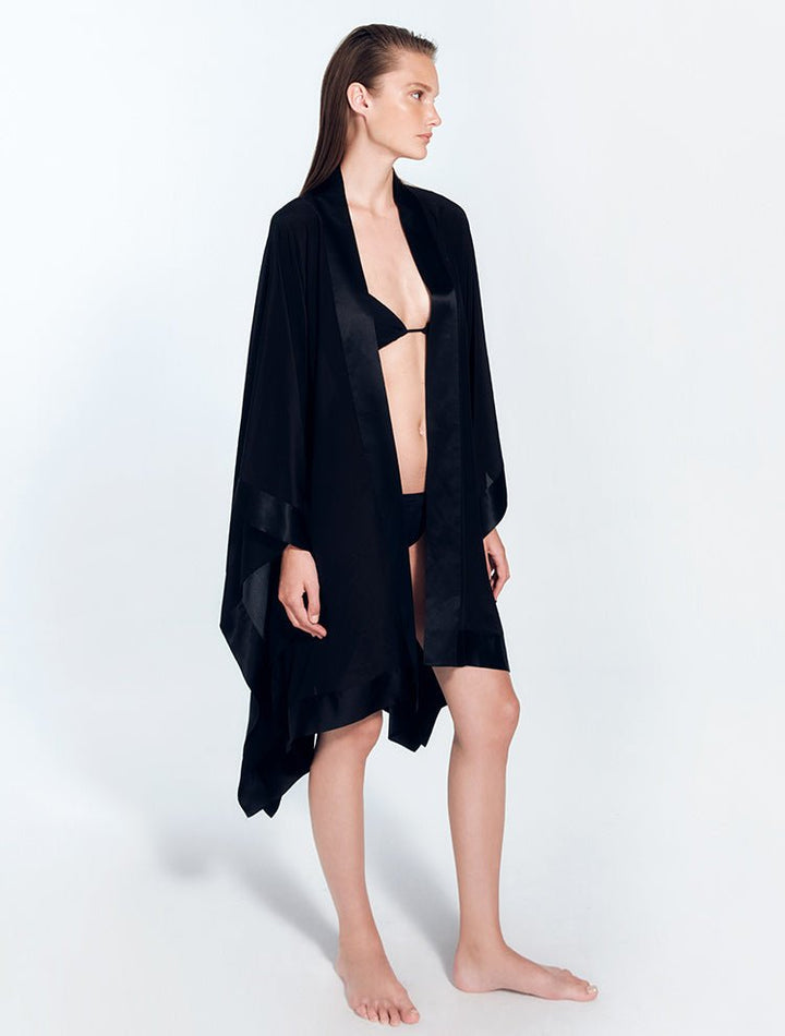Front View: Model in Delfina Black/Nude Kaftan - MOEVA Luxury Swimwear, Long Sleeved, Mid-Thigh Length, Short Silk Kaftan, MOEVA Luxury Swimwear