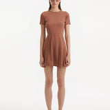 "Model wearing the Derin Brown Dress from the front, highlighting the knee-length cut, short sleeves, and shell-shaped gold buttons."