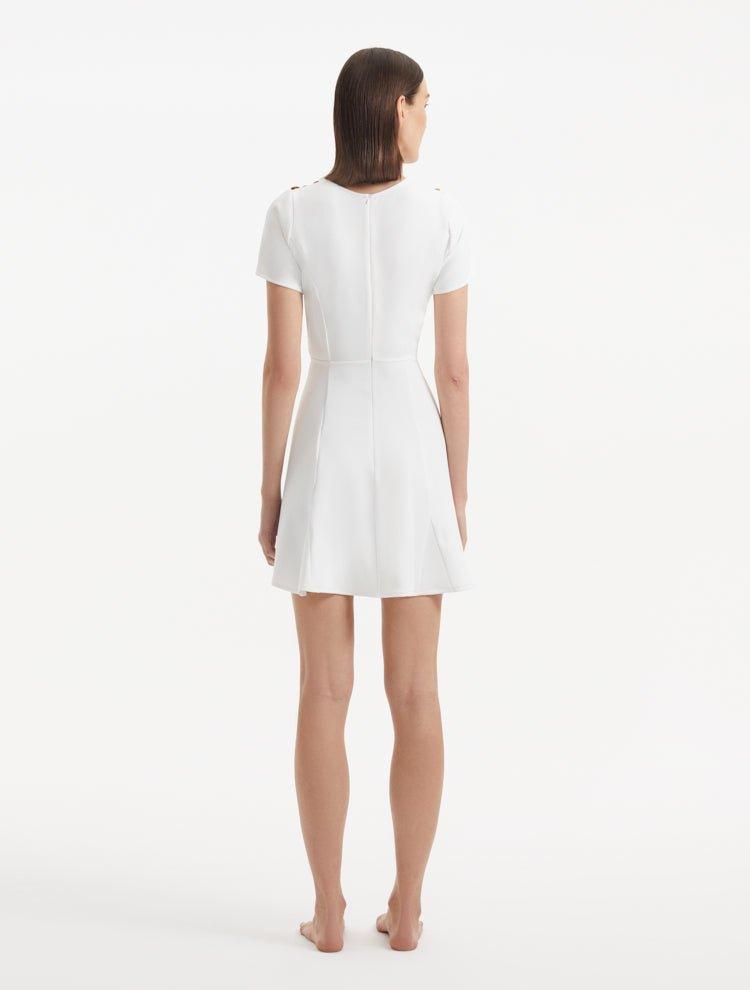 "Back view of the Derin White Dress, featuring the back zip and smooth lines of the design."