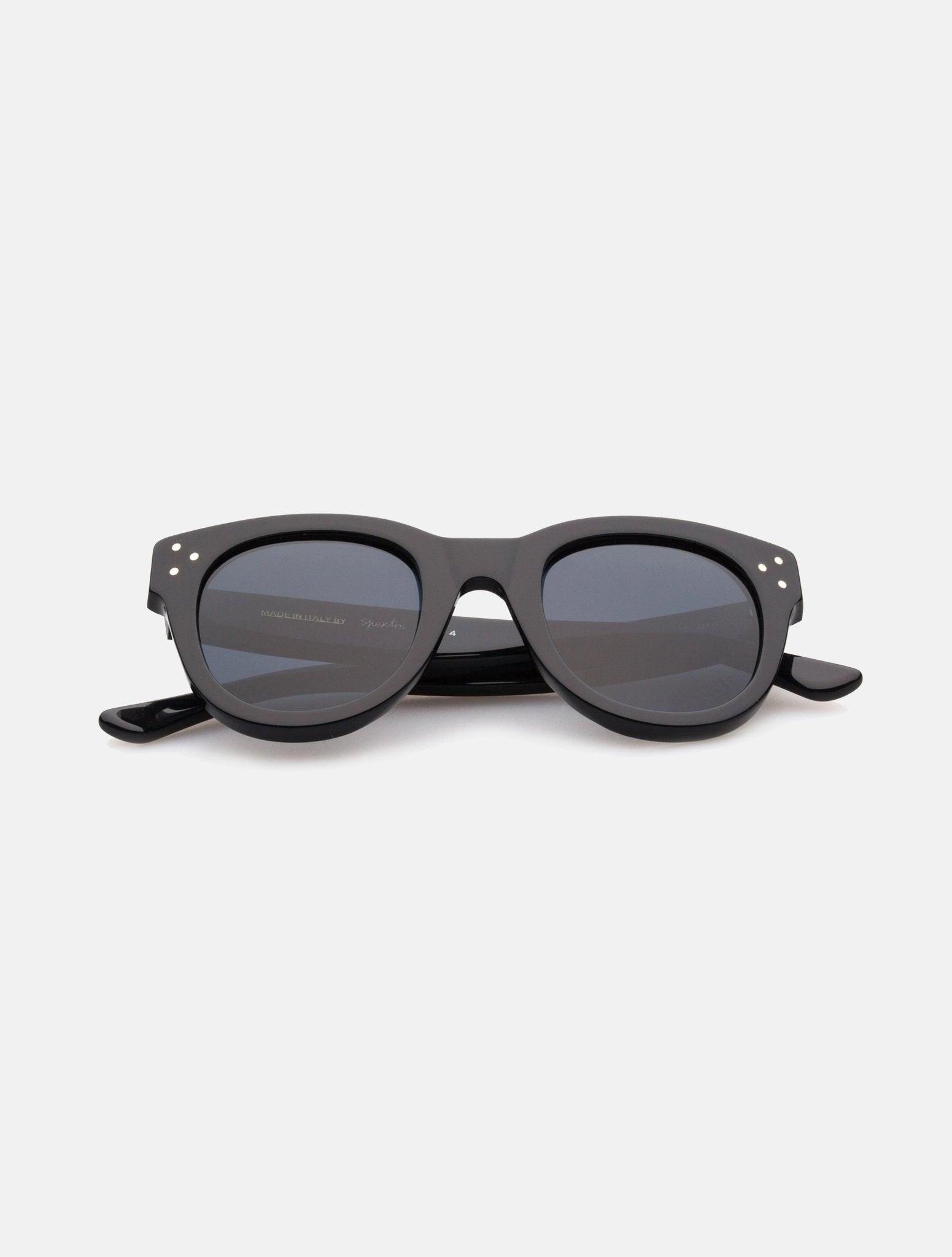 "Devin Black Sunglasses on a white background with glossy black acetate frames and tiny silver hardware spots."