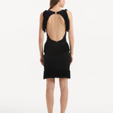 "Detailed view of the Diani Black Dress's back, highlighting the constellation of golden clasps and the low back design."