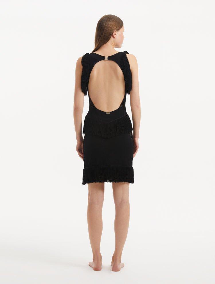 "Detailed view of the Diani Black Dress's back, highlighting the constellation of golden clasps and the low back design."