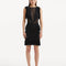 "Model showcasing the Diani Black Dress from the front, featuring a knee-length design and elegant mesh knit fabric."