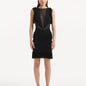 "Model showcasing the Diani Black Dress from the front, featuring a knee-length design and elegant mesh knit fabric."