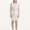 "Model displaying the Diani White Dress from the front, showcasing its knee-length design and pristine white mesh knit fabric."