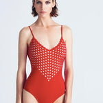  "Dolly Red Swimsuit front view with plunge neck, small side pockets, and button detailing."