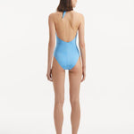 Back view of the Dwyn Baby Blue Swimsuit, showcasing the high waist and moderate bottom coverage.