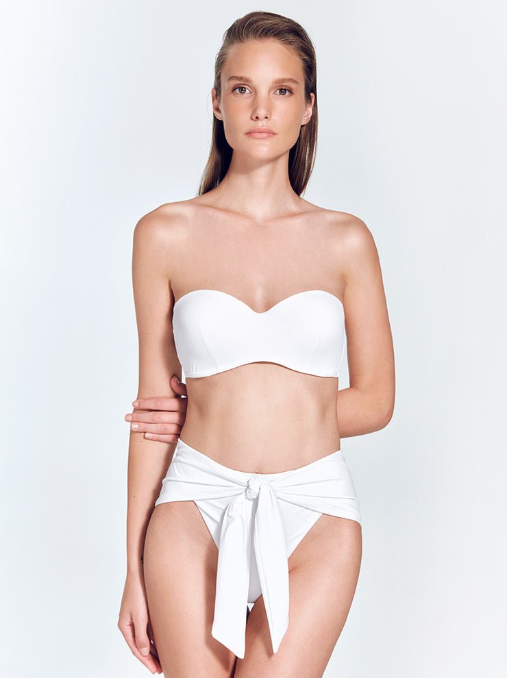 Front View: Model in Dylan White Bikini Top - MOEVA Luxury Swimwear, Strapless Top, Removable Padding, MOEVA Luxury Swimwear