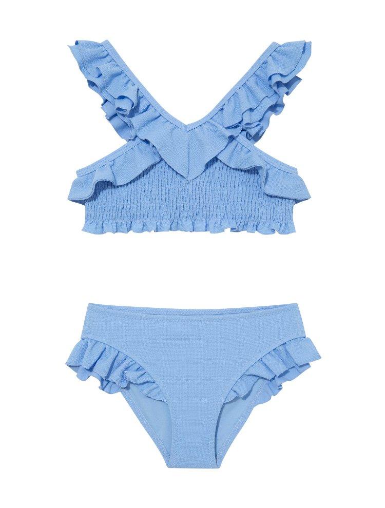 "Front view of the Effy baby blue kids bikini set, showcasing the V-neck top with ruffle details and full-coverage bottoms."
