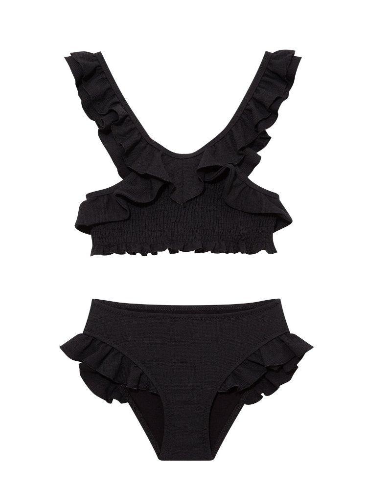 "Front view of the Effy black kids bikini set, highlighting the V-neck top with ruffle details and full-coverage bottoms."