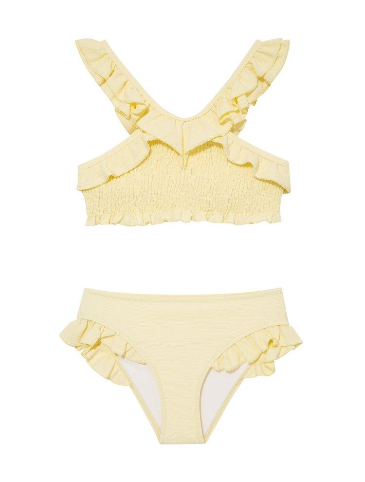 "Front view of the Effy yellow kids bikini set, showing the V-neck top with ruffle details and full-coverage bottoms."