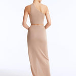 Rear view of the Eila Top and Lyndon Skirt, emphasizing the subtle Moeva logo plaque and intricate knit design.

