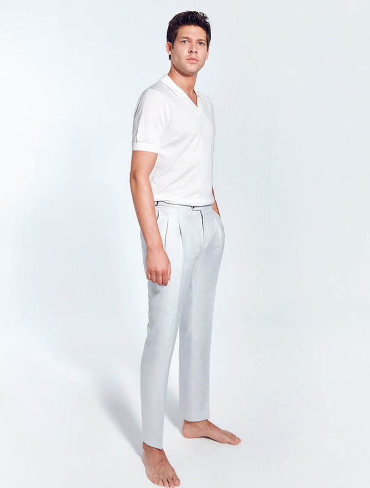 Front View: Model in Enzo Grey Pants - MOEVA Luxury Swimwear, Straight-Leg Cut, Pleats at Front, Slip Pocket, Welt Pockets, Mid-Rise, Ankle Length, MOEVA Luxury Swimwear