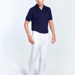 Front View: Model in Enzo White Pants - MOEVA Luxury Swimwear, Straight-Leg Cut, Pleats at Front, Slip Pocket, Welt Pockets, Mid-Rise, Ankle Length, Linen, Ready to Wear, Nikel Pants, Fully Lined, Classic Fit, MOEVA Luxury Swimwear