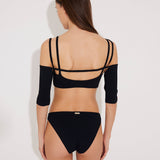 Back View: Model in Erie Black Bikini Top - MOEVA Luxury Swimwear, Removable Sleeves, Complete the Look with Ontario Skirt, MOEVA Luxury Swimwear   