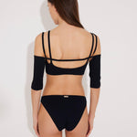 Back View: Model in Erie Black Bikini Bottom - MOEVA Luxury Swimwear, Lined, Full Coverage, Hipster Knitted Swim Bottom, MOEVA Luxury Swimwear