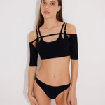 Front View: Model in Erie Black Bikini Bottom - MOEVA Luxury Swimwear, Lined, Full Coverage, Hipster Knitted Swim Bottom, Knitted, Low Waist, Hipster Bottom, MOEVA Luxury Swimwear
