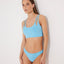 Front View: Model in Erie Blue Bikini Top - MOEVA Luxury Swimwear, Day to Night, Knitted, Scoop Neck Knitted Swim Top, Gold Hook Detail, Tie-Back Luxury Swim Top, MOEVA Luxury Swimwear  