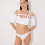 Front View: Model in Erie White Bikini Top - MOEVA Luxury Swimwear, Removable Sleeves, Day to Night, Knitted, Scoop Neck Knitted Swim Top, Scoop Neck Knitted Swim Top , Gold Hook Detail, Tie-Back Luxury Swim Top, MOEVA Luxury Swimwear  