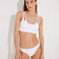 Front View: Model in Erie White Bikini Bottom - MOEVA Luxury Swimwear, Comfortable Fit, Stylish Design, Well-Knit Stretchy Yarn, Lined, Full Coverage, Hipster Knitted Swim Bottom, Knitted, Low Waist, MOEVA Luxury Swimwear