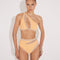 Model wearing the Etta Orange/Nude One-Shoulder Bikini Set from the front, showcasing the dramatic cut-out design, mesh details, and one-shoulder style. "