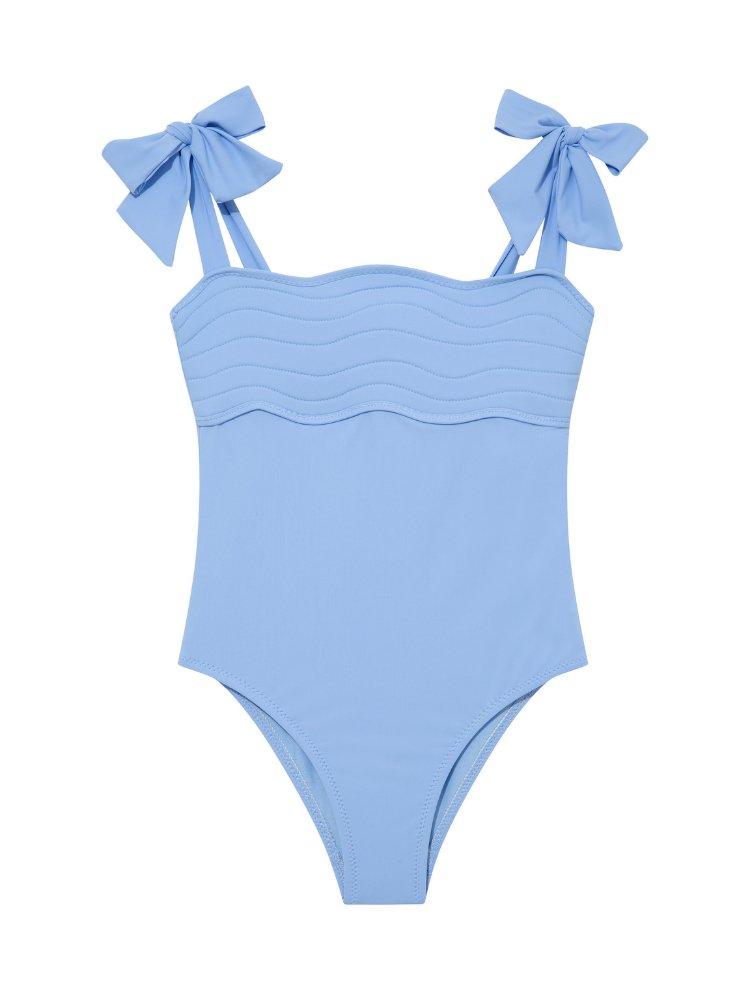 Model wearing the Everlee Baby Blue Swimsuit, showcasing the self-tie straps and ruffle details.