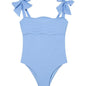 Model wearing the Everlee Baby Blue Swimsuit, showcasing the self-tie straps and ruffle details.