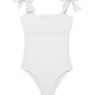 Model wearing the Everlee White Swimsuit, highlighting the self-tie straps and ruffle details.