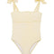 Model wearing the Everlee Yellow Swimsuit, showcasing the self-tie straps and ruffle details.