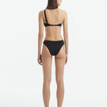 Back view of the Eyre Black Bikini Bottom, showcasing the full-coverage design and elegant silhouette.