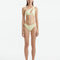 Model wearing the Eyre Yellow Bikini Bottom, showcasing the mid-rise hipster design and shell-shaped gold buttons.