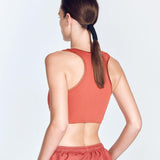 "Fanny Red Ochre Sports Bra back view showcasing the geometric design and smooth satin matte fabric. 