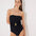 Front View: Model in Felice Black Swimsuit - Strapless, Soft Touch Fabric, Fully Lined and Twisted Gold Accessory Detail, MOEVA Luxury Swimwear 
