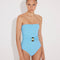 Front View: Model in Felice Blue Swimsuit - Strapless, Soft Touch Fabric, Fully Lined and Twisted Gold Accessory Detail, MOEVA Luxury Swimwear 