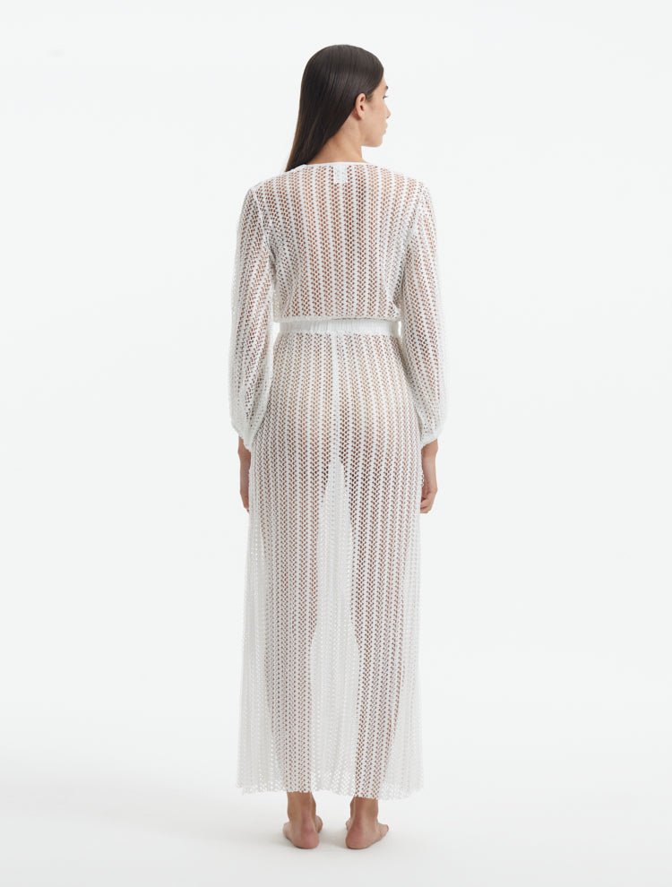 Back View: Model in Fernanda White Dress - MOEVA Luxury Swimwear, Ankle Length, Loose Fit, Chain Knitted Fabric, MOEVA Luxury Swimwear