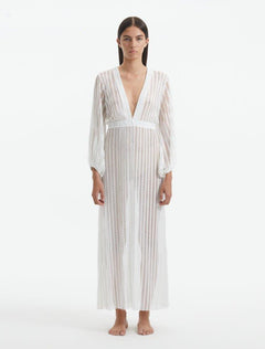 Front View: Model in Fernanda White Dress - MOEVA Luxury Swimwear, V Neckline, Blouson Sleeves, Fitted Cuffs, MOEVA Luxury Swimwear