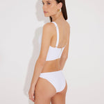 Back View: Model in Franca White Bikini Bottom - Moderate Bottom Coverage, Lined, Italian Fabric, Sportive and Comfort Chic Low Waist Bikini Bottom, Special Lycra Xtralife Certificate, MOEVA Luxury Swimwear  