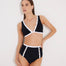 "Greca black and white high-waisted bikini bottom with gold buttons, front view, showing elegant design and flawless fit."