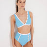 Front View: Model in Greca Blue/White Bikini Bottom - MOEVA Luxury Swimwear, High-Waist, Gold Button Details, Duo Colored, Full Bottom Coverage MOEVA Luxury Swimwear  