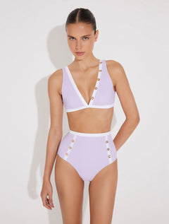 Front View: Model in Greca Lilac/White Bikini Top - MOEVA Luxury Swimwear, V-Neck, Gold Button Details, Duo Colored, Removable Padding, MOEVA Luxury Swimwear 