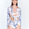"Front view of a model in the Greta Blue Abstract Shirt, displaying its cropped length and stylish design."