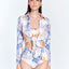 Front View: Model in Greta Blue Abstract Shirt - MOEVA Luxury Swimwear, Cropped Silhouette, Made of Swimwear Fabric, Tie at the Front, Unlined, Comfort and Day to Night, MOEVA Luxury Swimwear