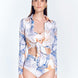 "Front view of a model in the Greta Blue Abstract Shirt, displaying its cropped length and stylish design."