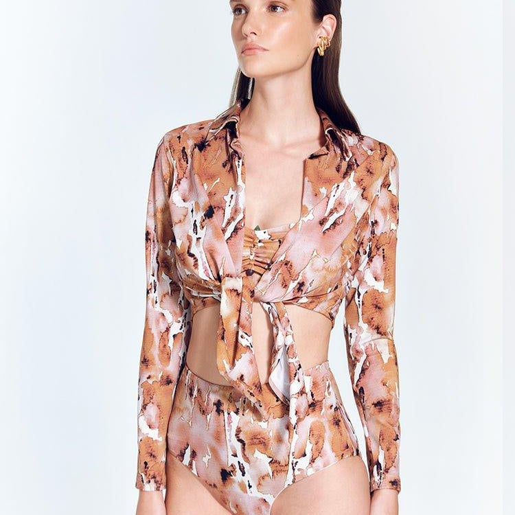 Greta Floral Abstract Long Sleeve Tie Front Shirt | Moeva | Shirt | Each week unveils new pieces—luxury swimwear, fluid resort silhouettes, and elevated summer-to-evening essentials designed to carry you from coastal escapes to city nights.