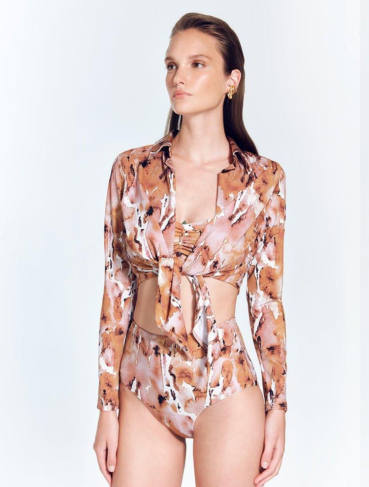 "Front view of a model in the Greta Floral Abstract Shirt, displaying its cropped length and stylish design."